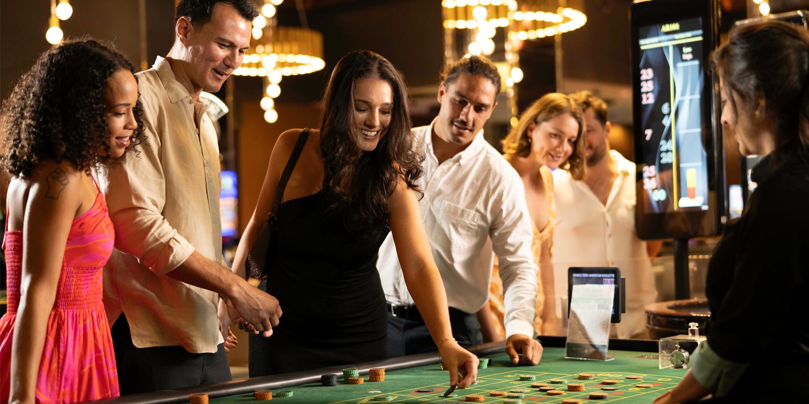 Group of friends playing at a table game at Mindil Beach