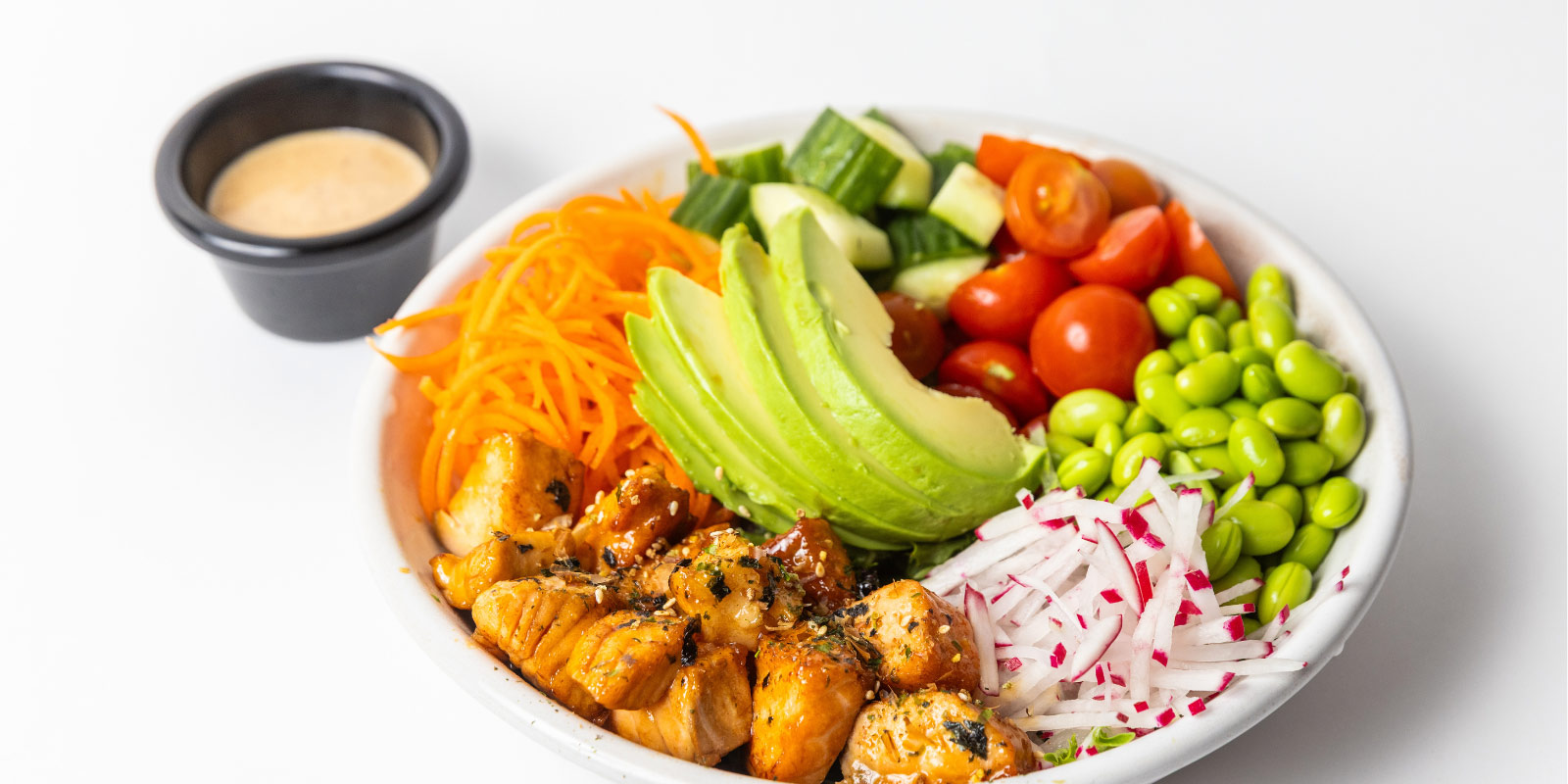 Veggie bowl with dip on the side.