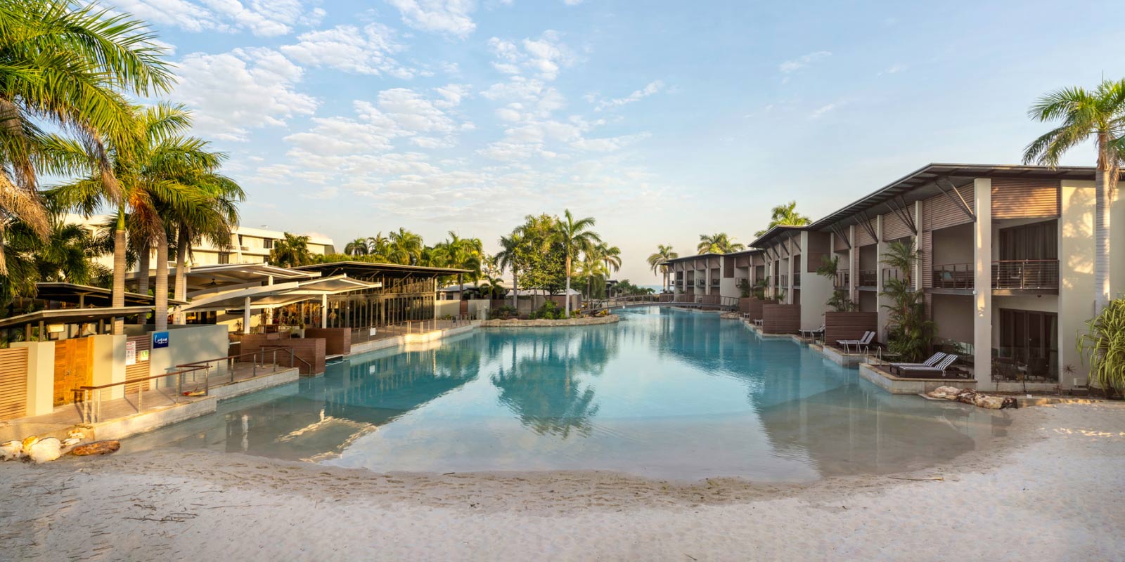 View of the pool with the balconies of the hotel on the right